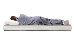 person sleeping on a mattress